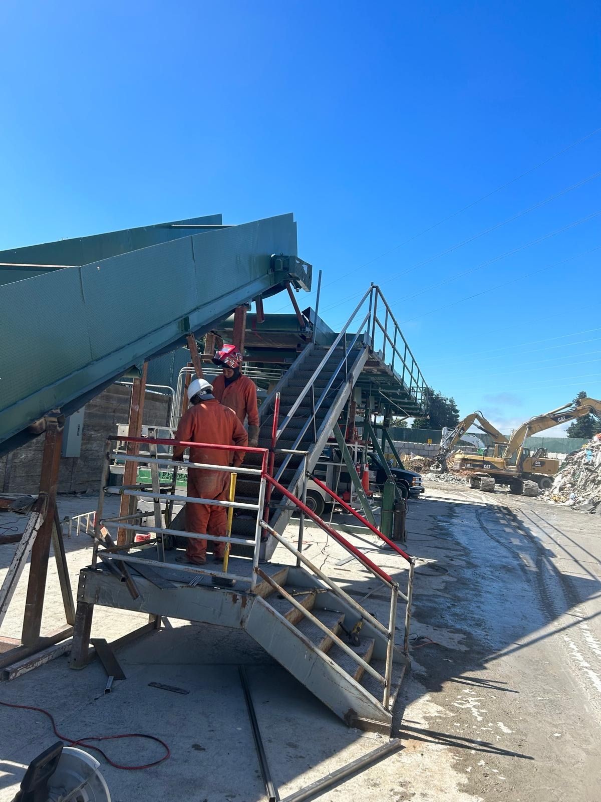 Field welding and reinforcement of structural platform and conveyor system at recycling facility jobsite in the Bay Area