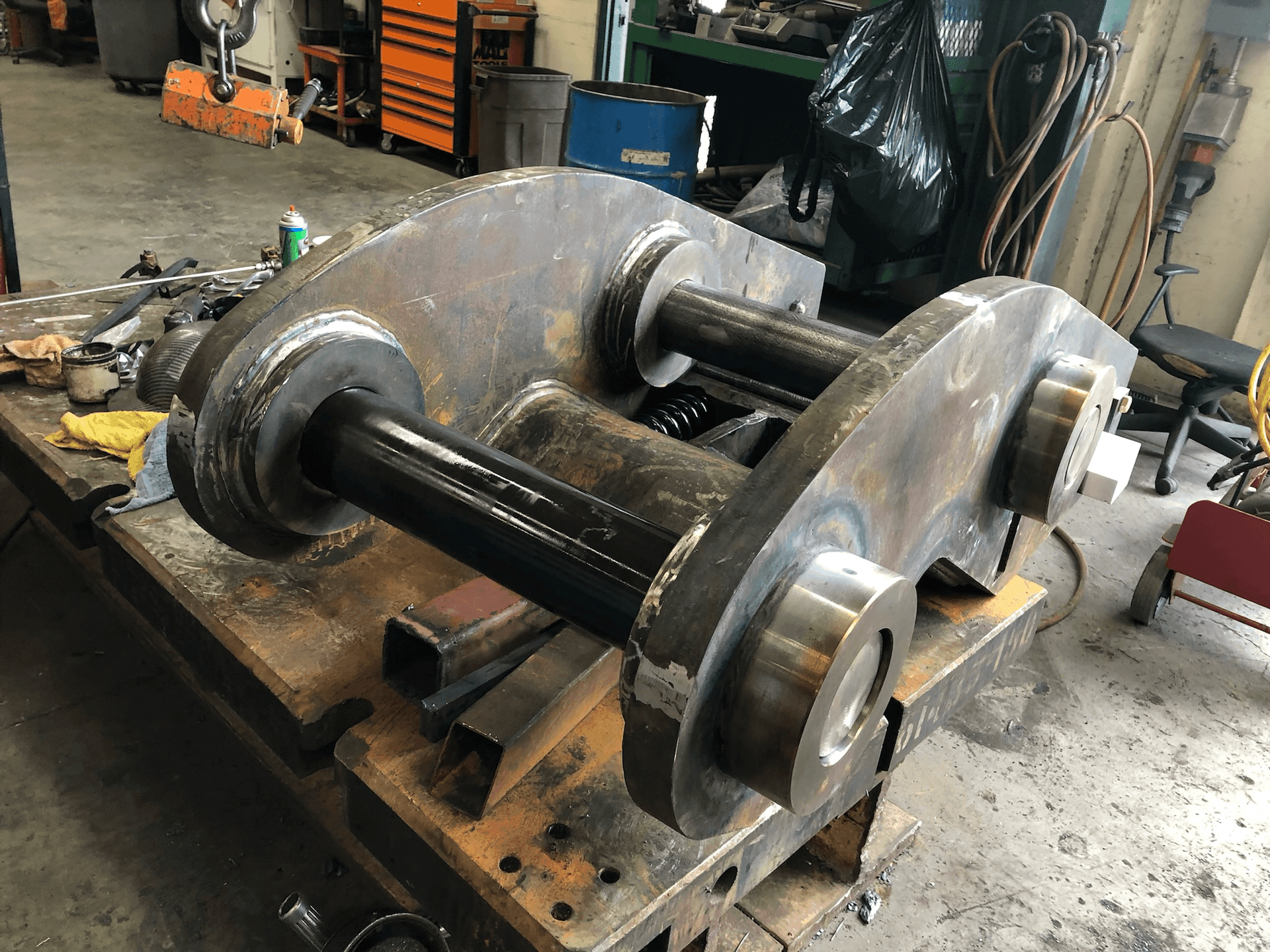 Precision welding and fit-up of excavator component performed inside certified fabrication shop in the Bay Area