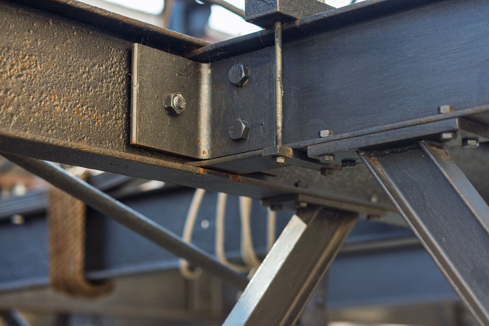 Steel beams being connected on construction site